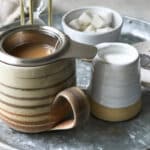 A cup of masala chai tea brewing.