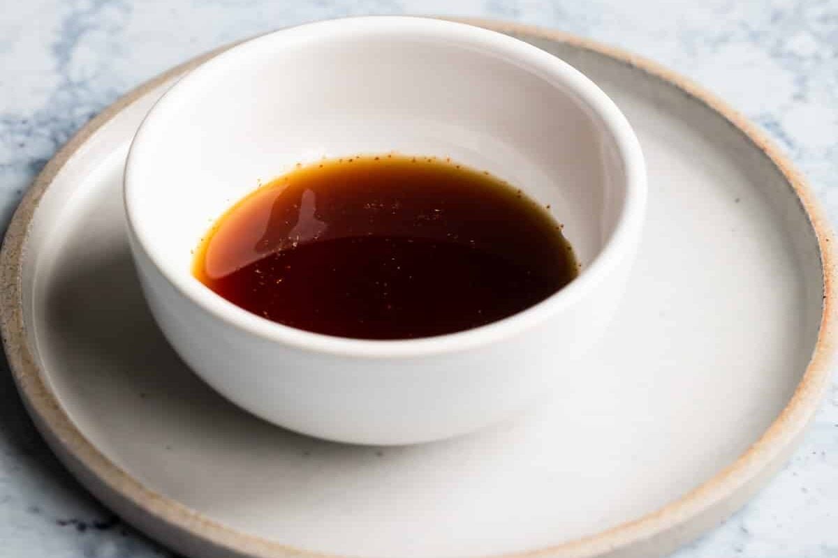 Ponzu sauce in a white dish.