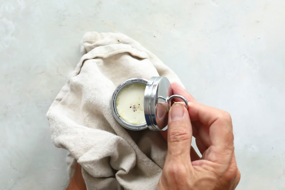 Screwing a cap on an egg coddler.