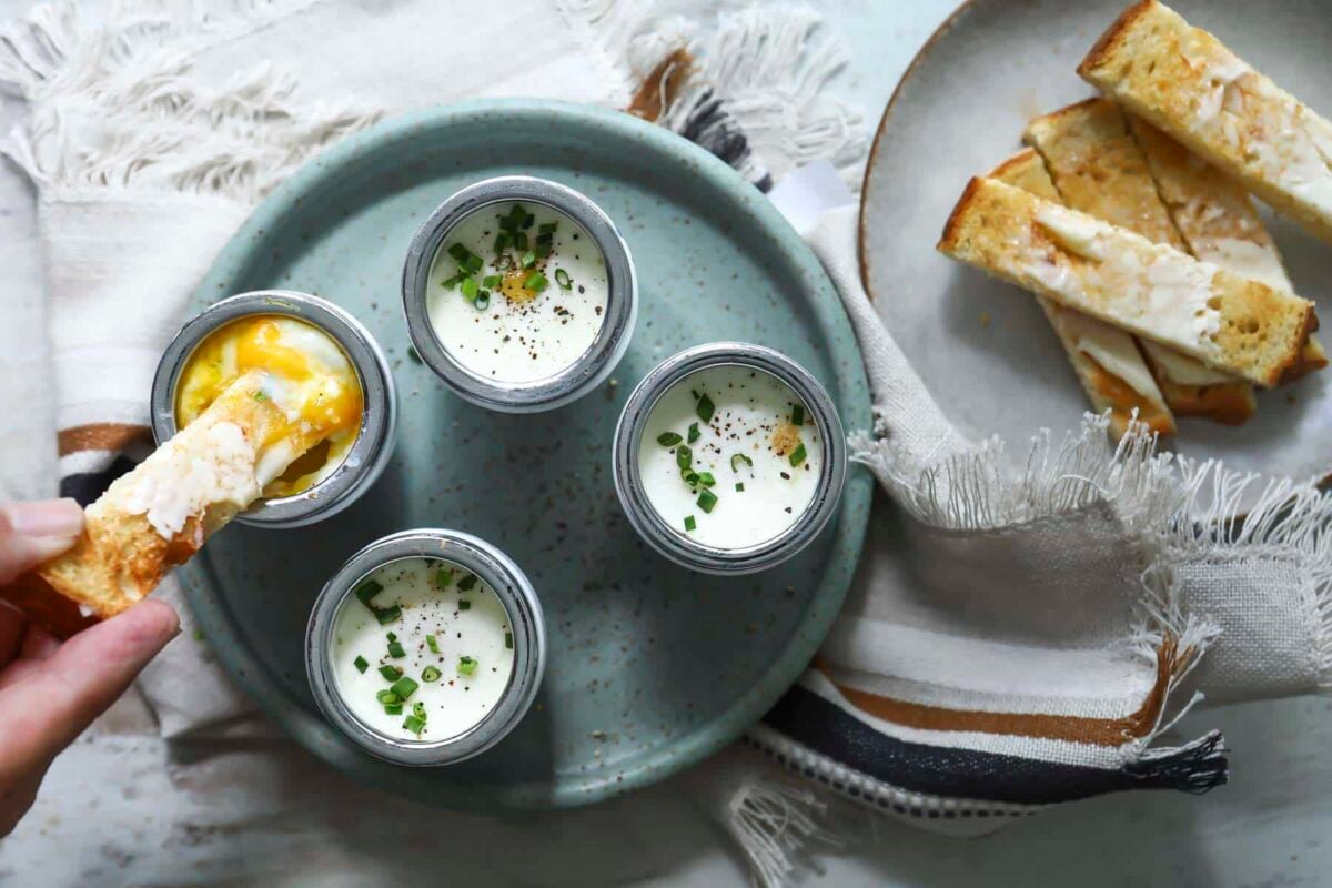 4 coddled eggs in individual coddlers.