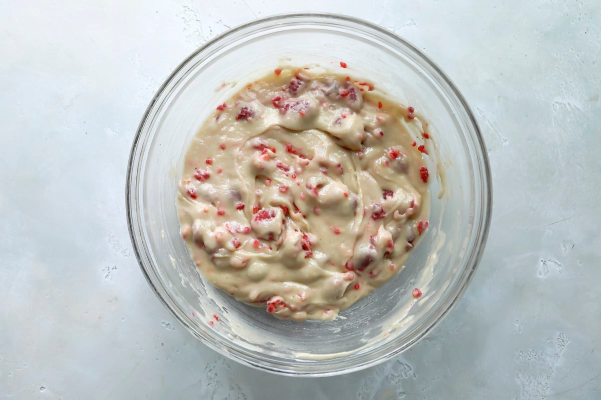 A bowl of raspberry muffin batter.
