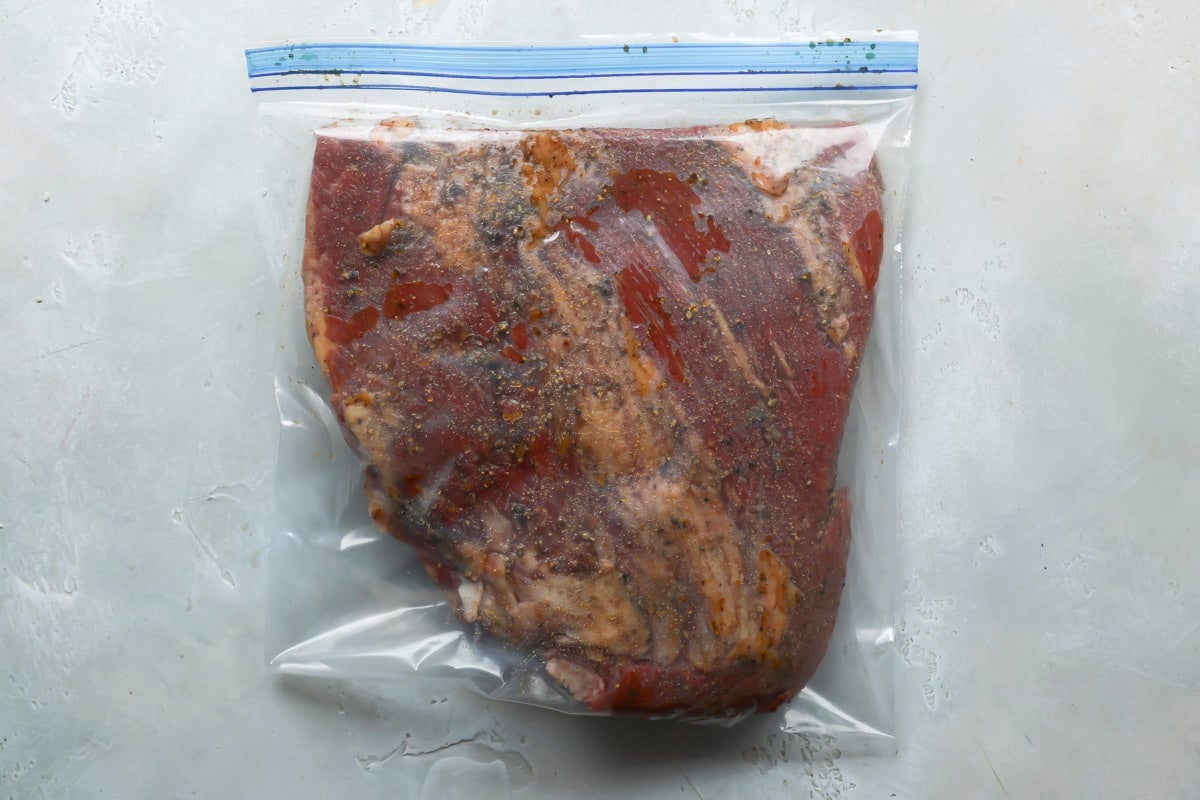 Brisket in a plastic bag with marinade.
