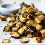 Air fryer eggplant on a white serving platter.