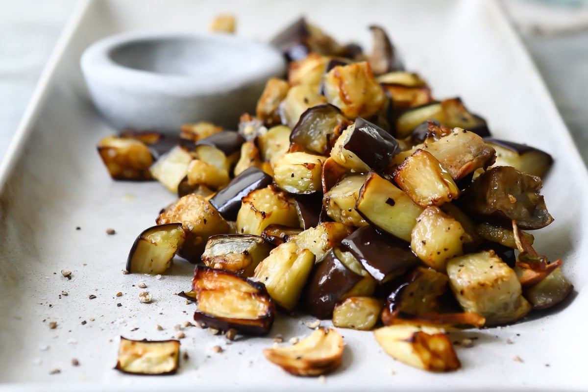Air fryer eggplant on a white serving platter.