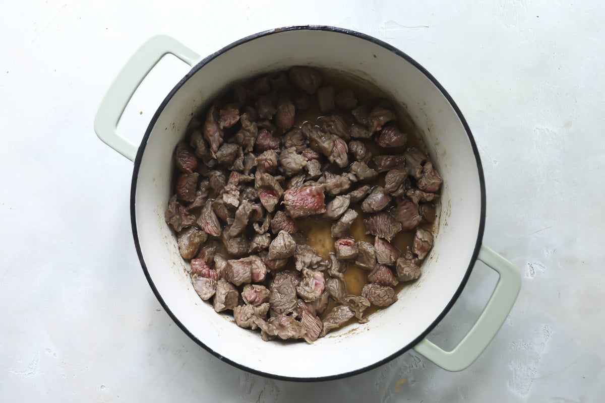 Cooking meet and vegetables for borscht soup.