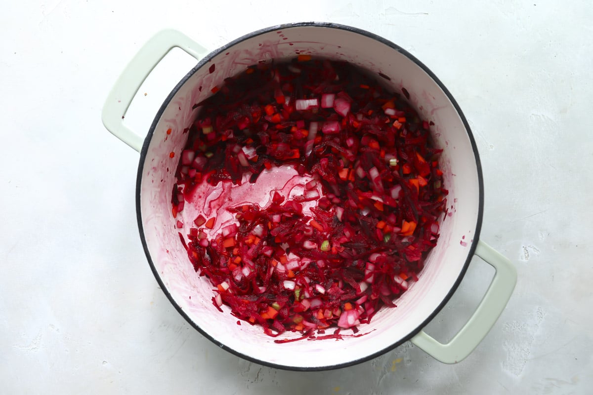 Cooking meet and vegetables for borscht soup.