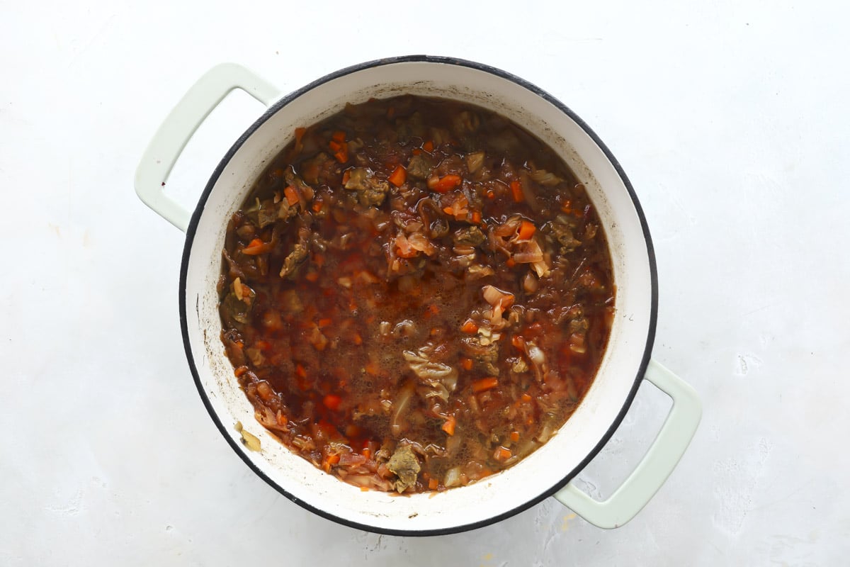 Cooking meet and vegetables for borscht soup.