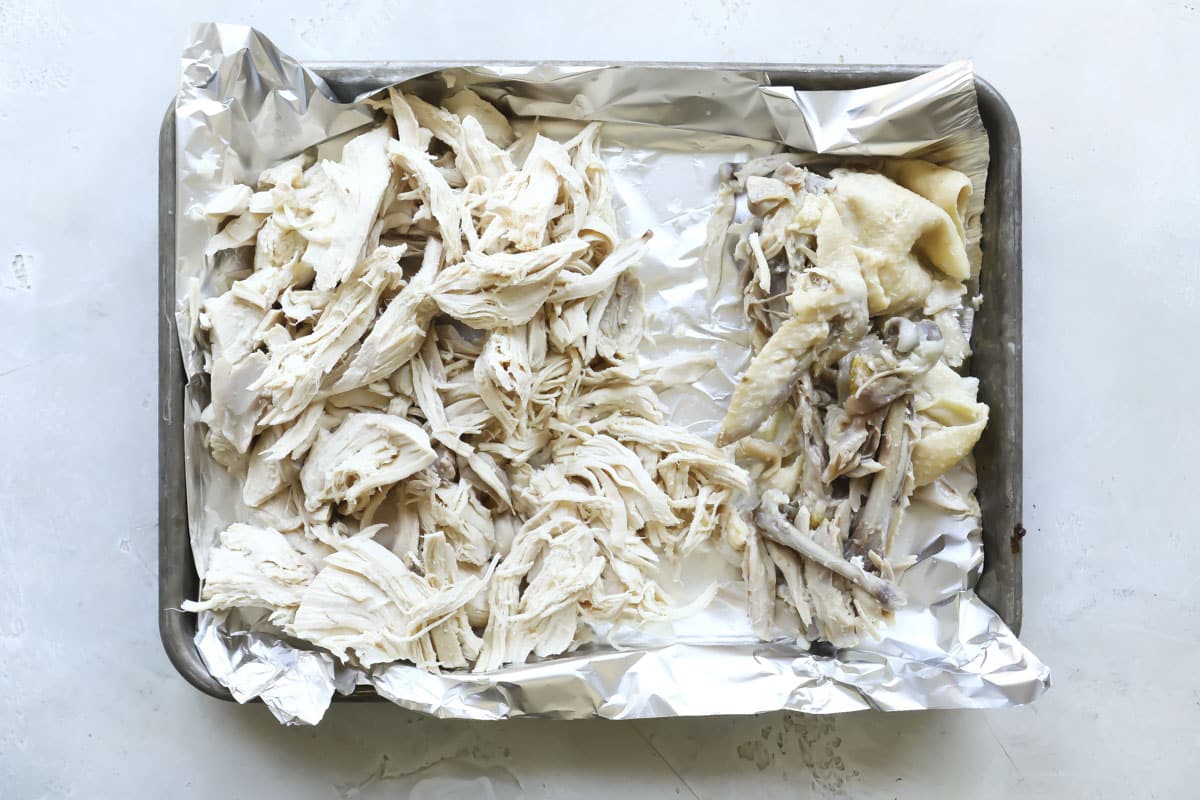 Shredded chicken on a baking sheet.