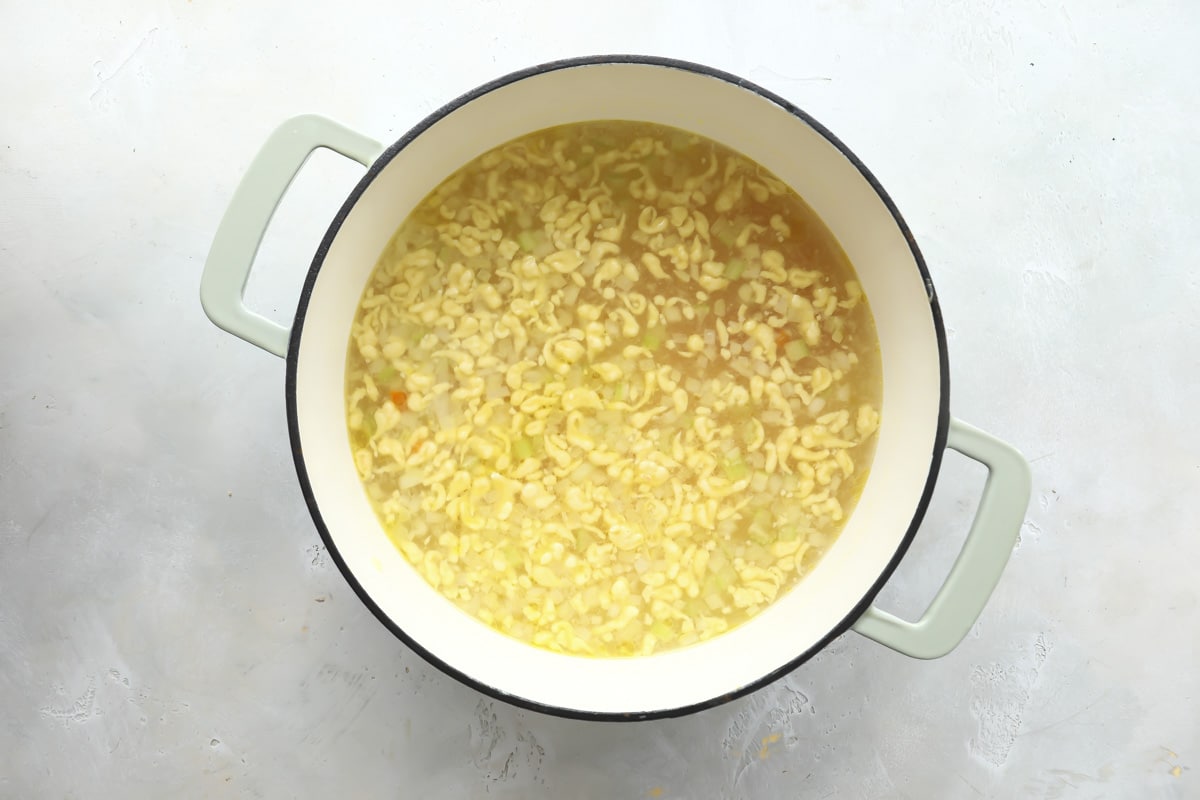 A pot of chicken dumpling soup.