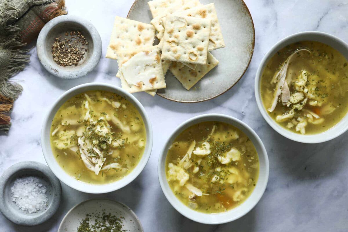 Three bowls of chicken dumpling soup.