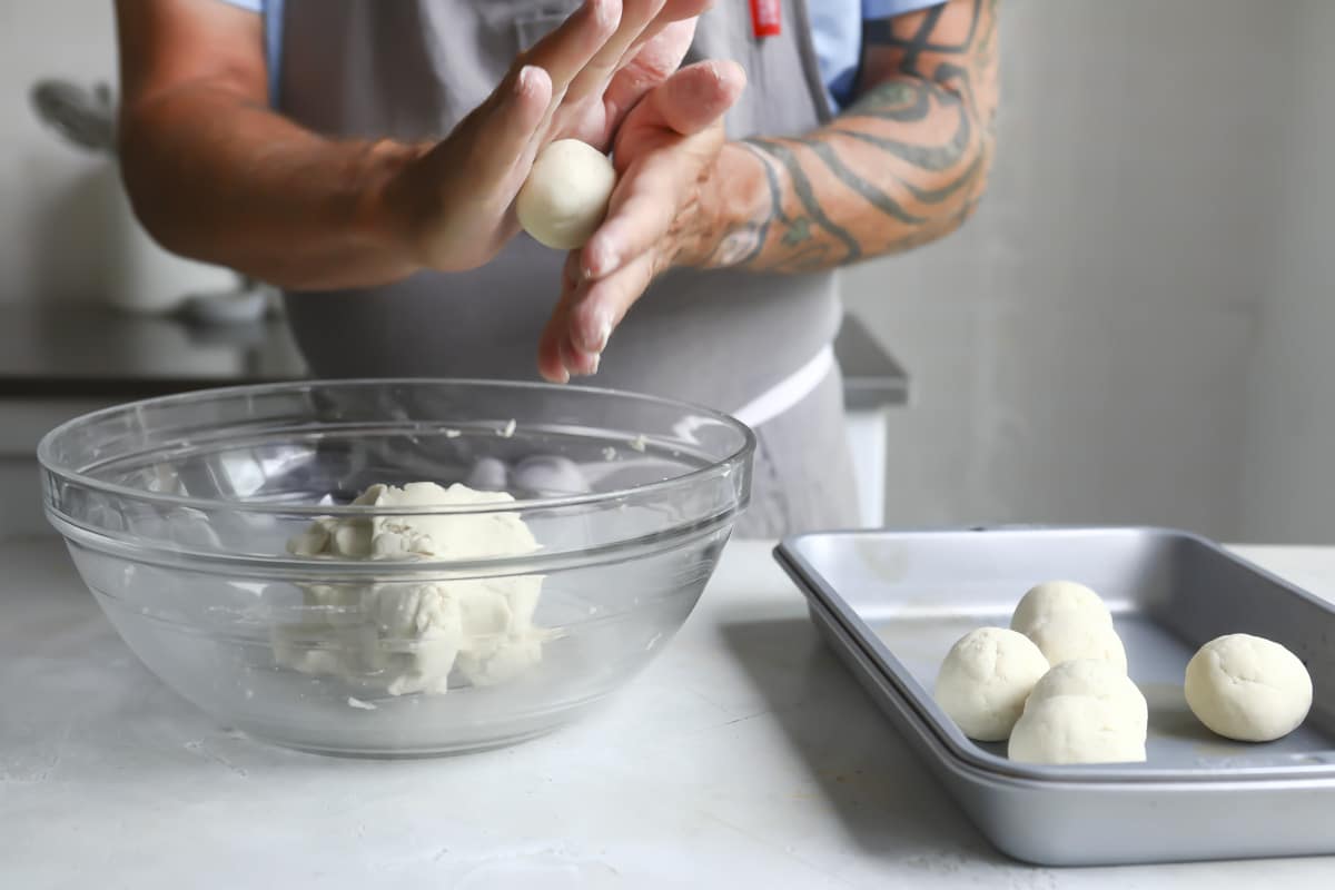Rolling masa into a ball for corn tortillas.
