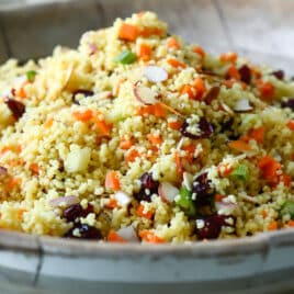 A bowl of curried couscous salad.