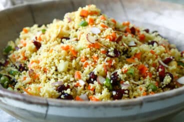 A bowl of curried couscous salad.