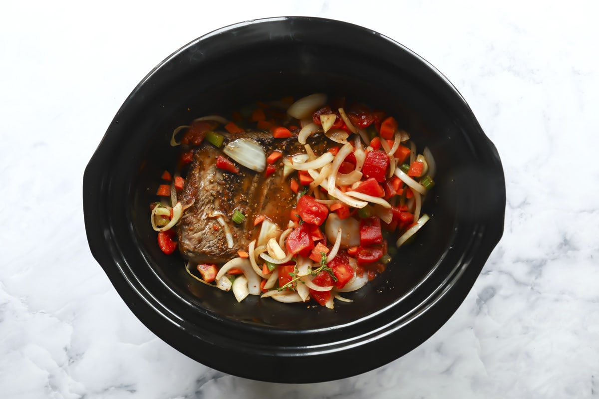 Slow cooker beef brisket in a crockpot before cooking.