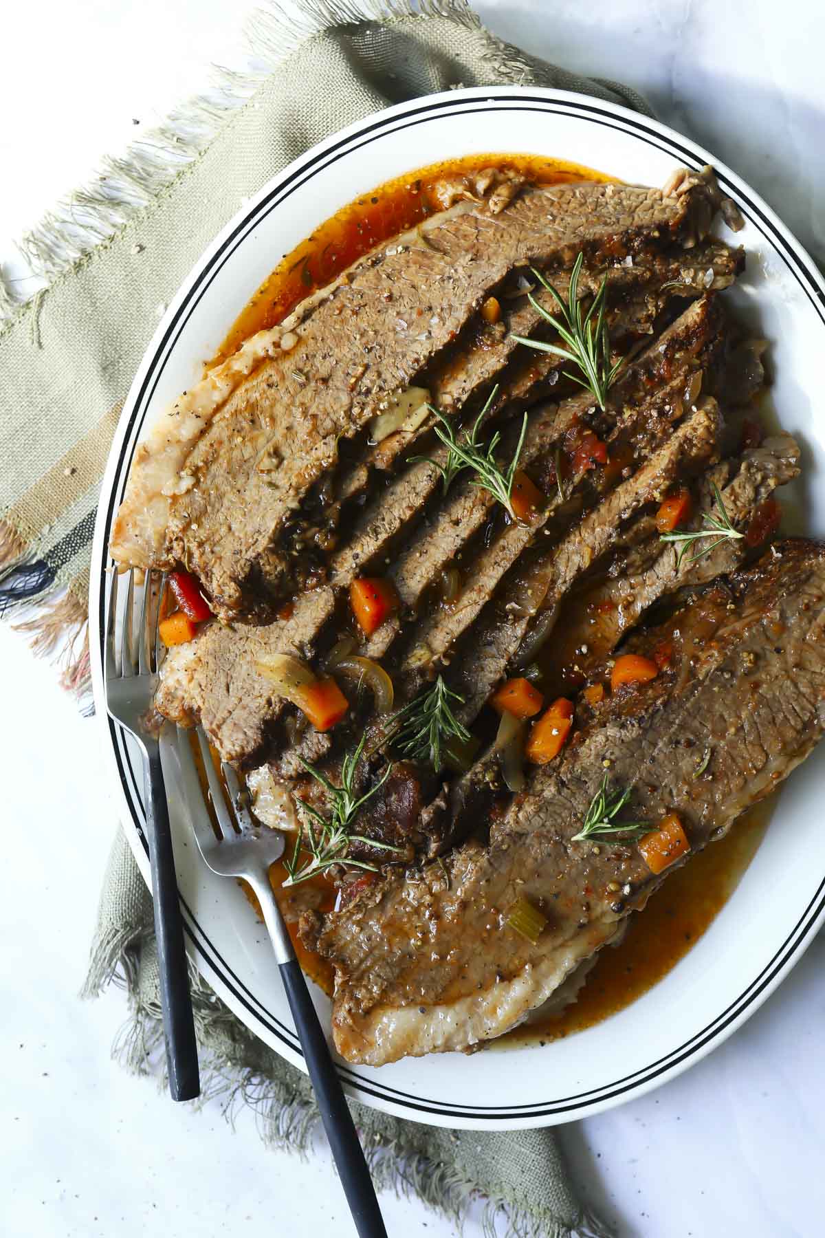 Sliced beef brisket on a platter.