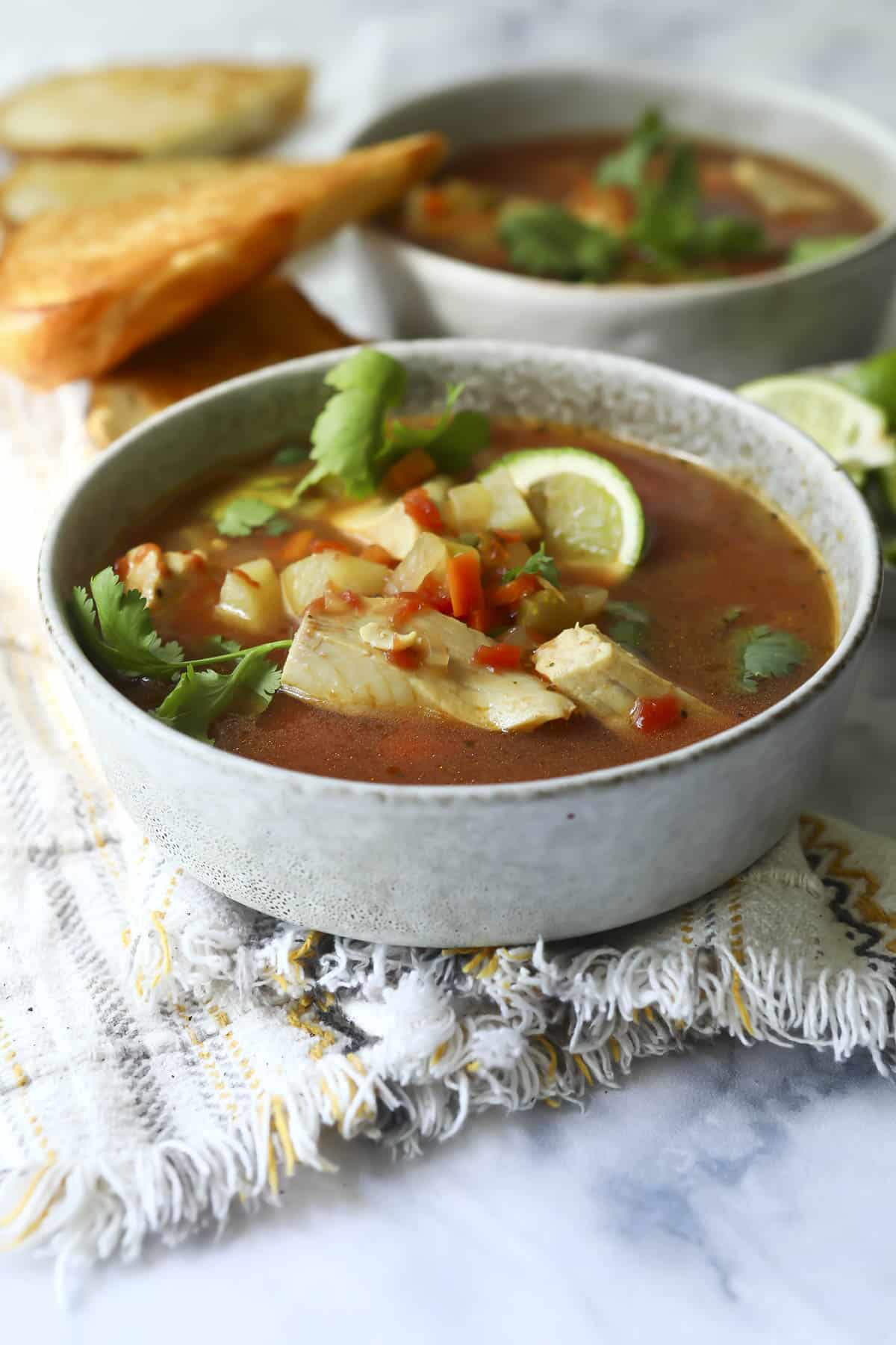 A bowl of Mexican fish soup (sopa de pescado).