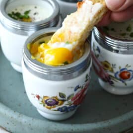 4 coddled eggs in individual coddlers.