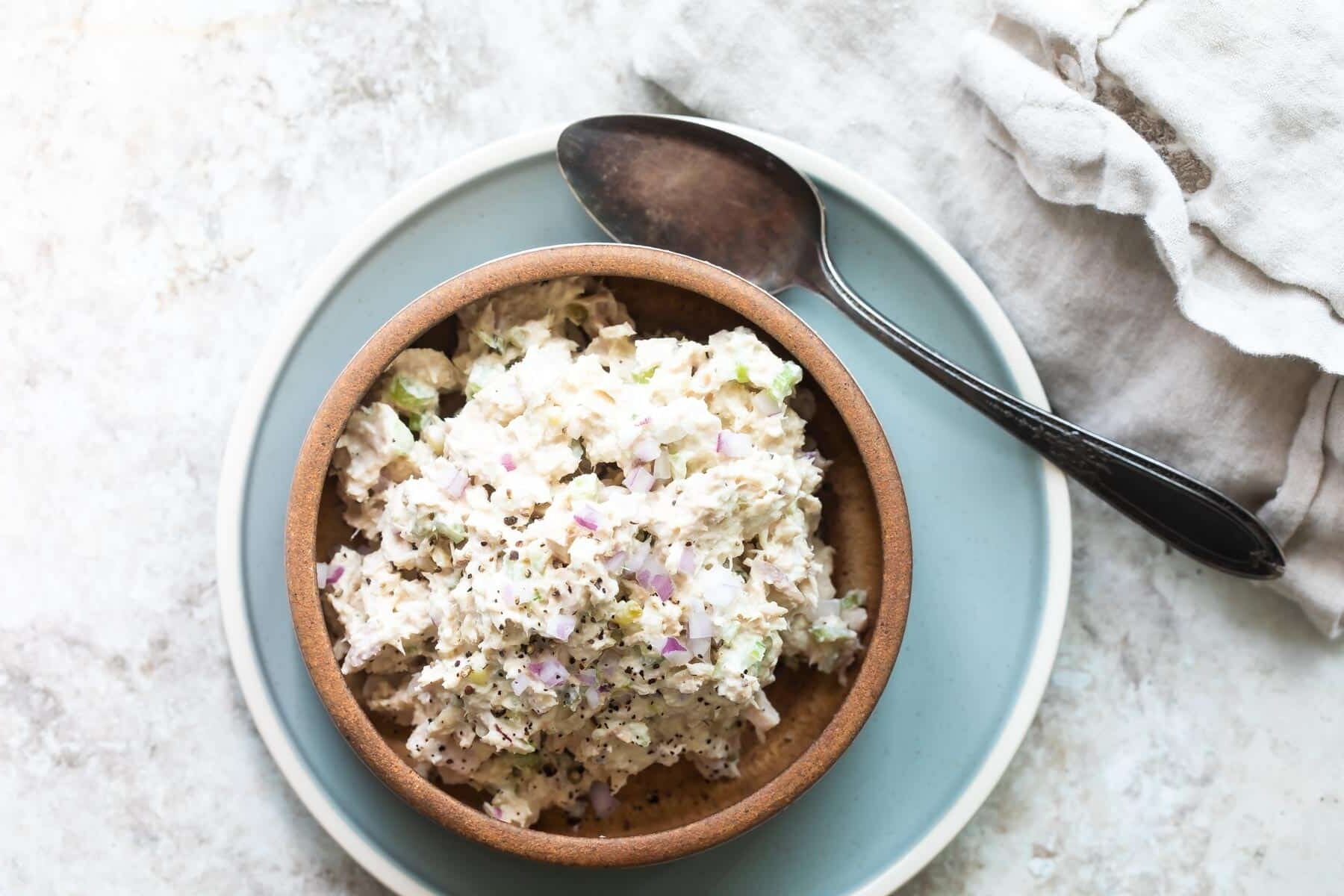Tuna salad in a brown bowl.