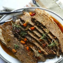 Sliced beef brisket on a platter.