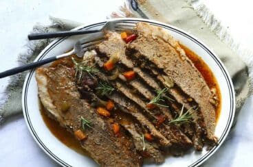 Sliced beef brisket on a platter.