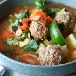 One blue bowls of Albondigas soup.