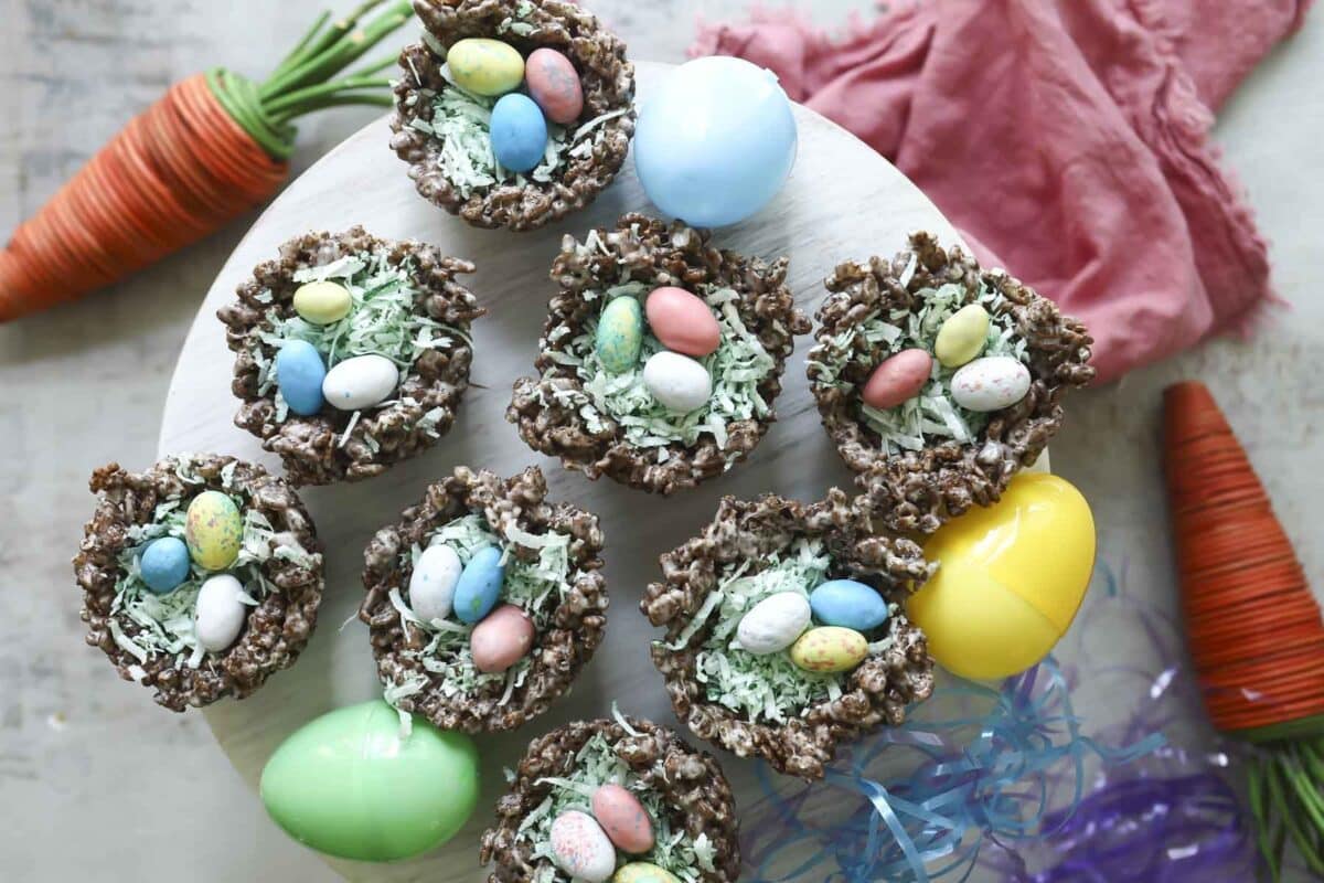 Easter rice krispie treats on a platter with plastic eggs.