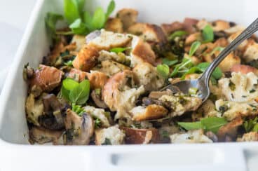 A white dish of vegan stuffing.