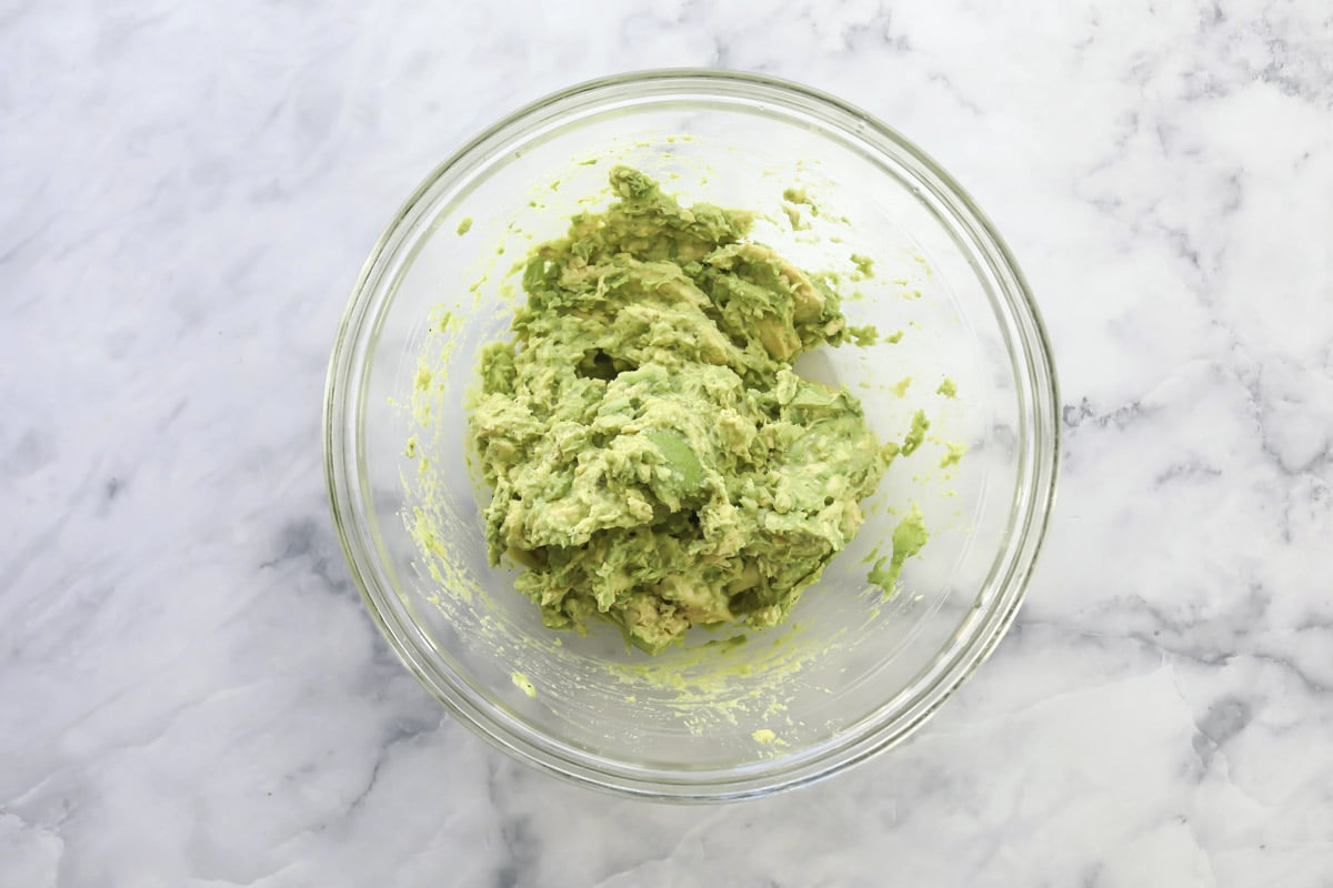 A bowl of mashed avocado.