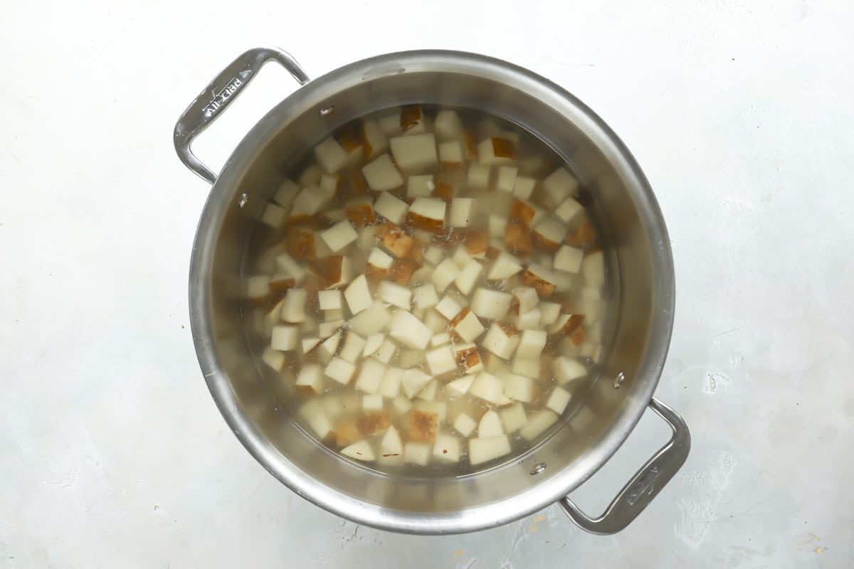 Cubed potatoes in water to boil.
