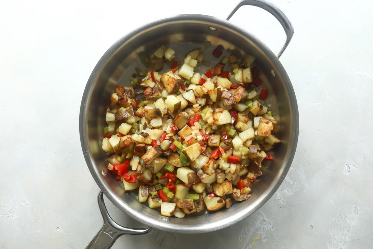 A skillet of Potatoes O'Brien (potatoes with peppers and onions).
