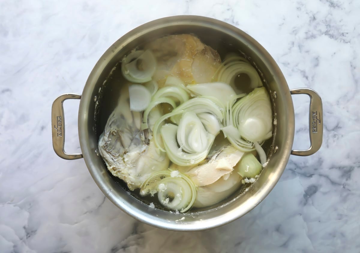 Homemade broth simmering in a pot.