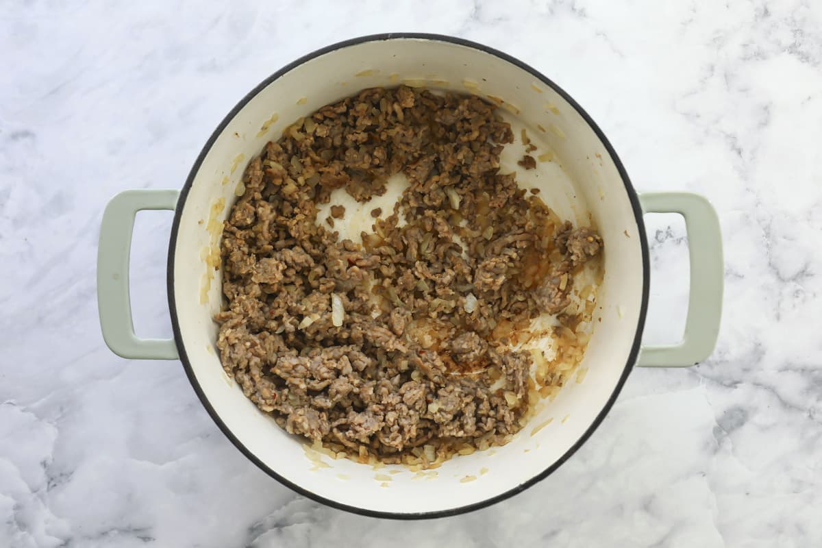 Sausage cooking in a pot for soup.