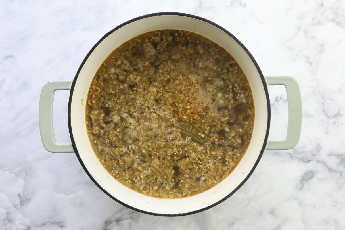 Sausage cooking in a pot for soup.