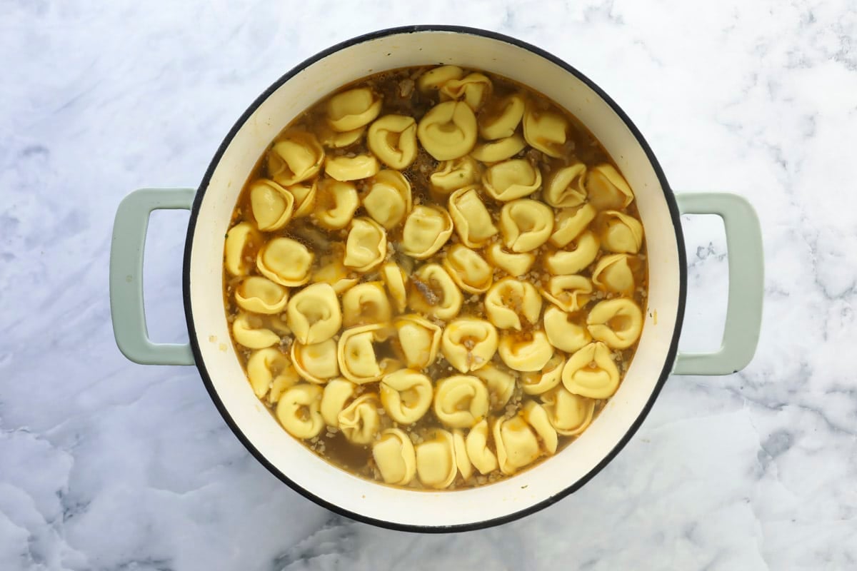 A pot of sausage tortellini soup.