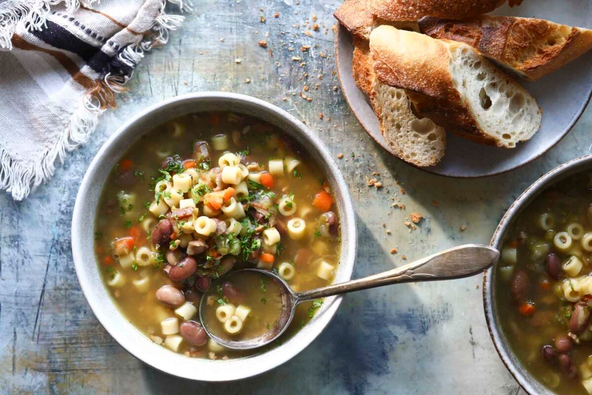 A bowl of pasta and bean soup.