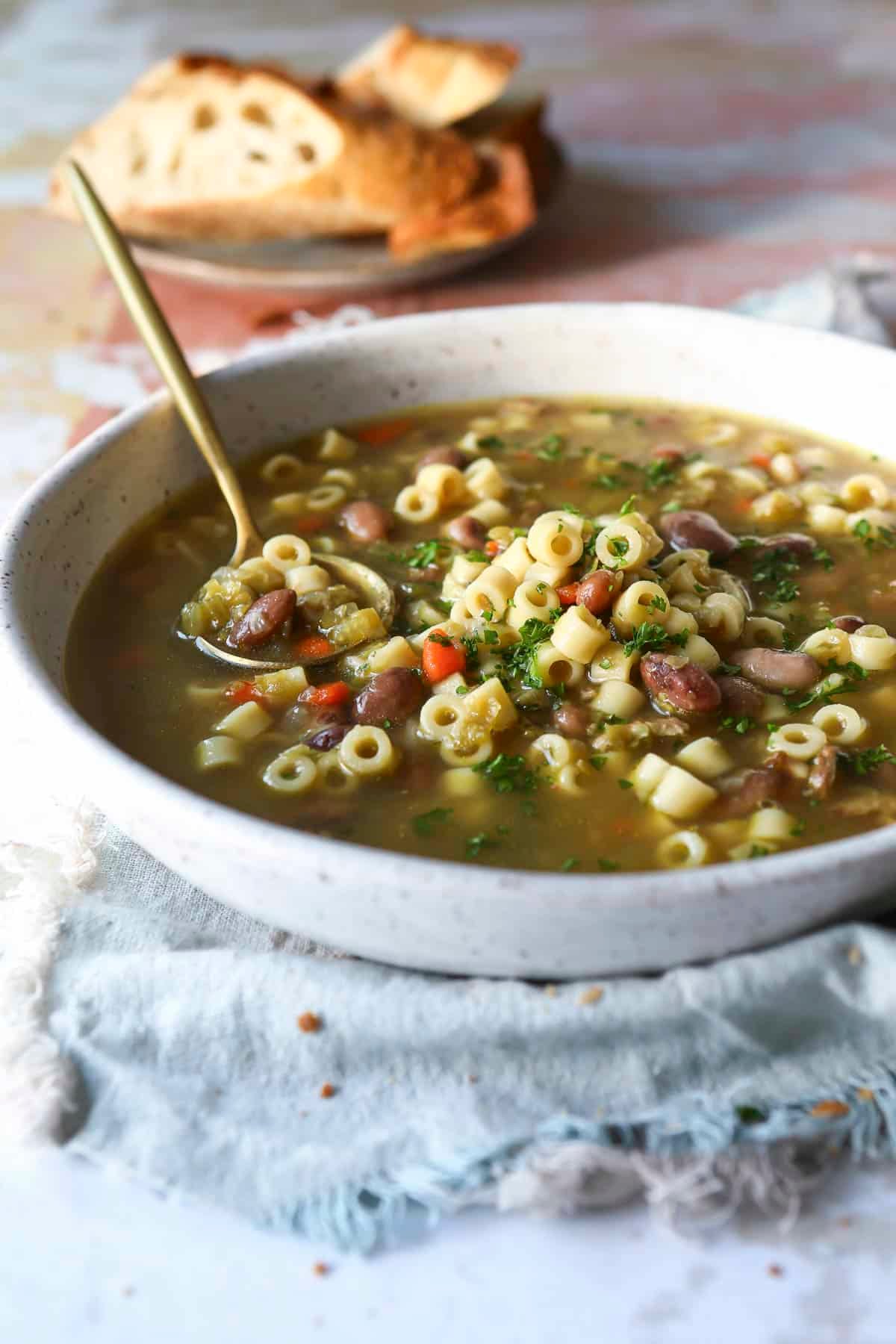 A bowl of pasta and bean soup.