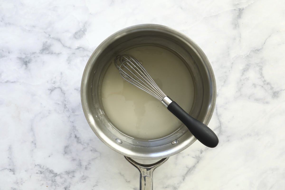 Sugar and water in a saucepan.