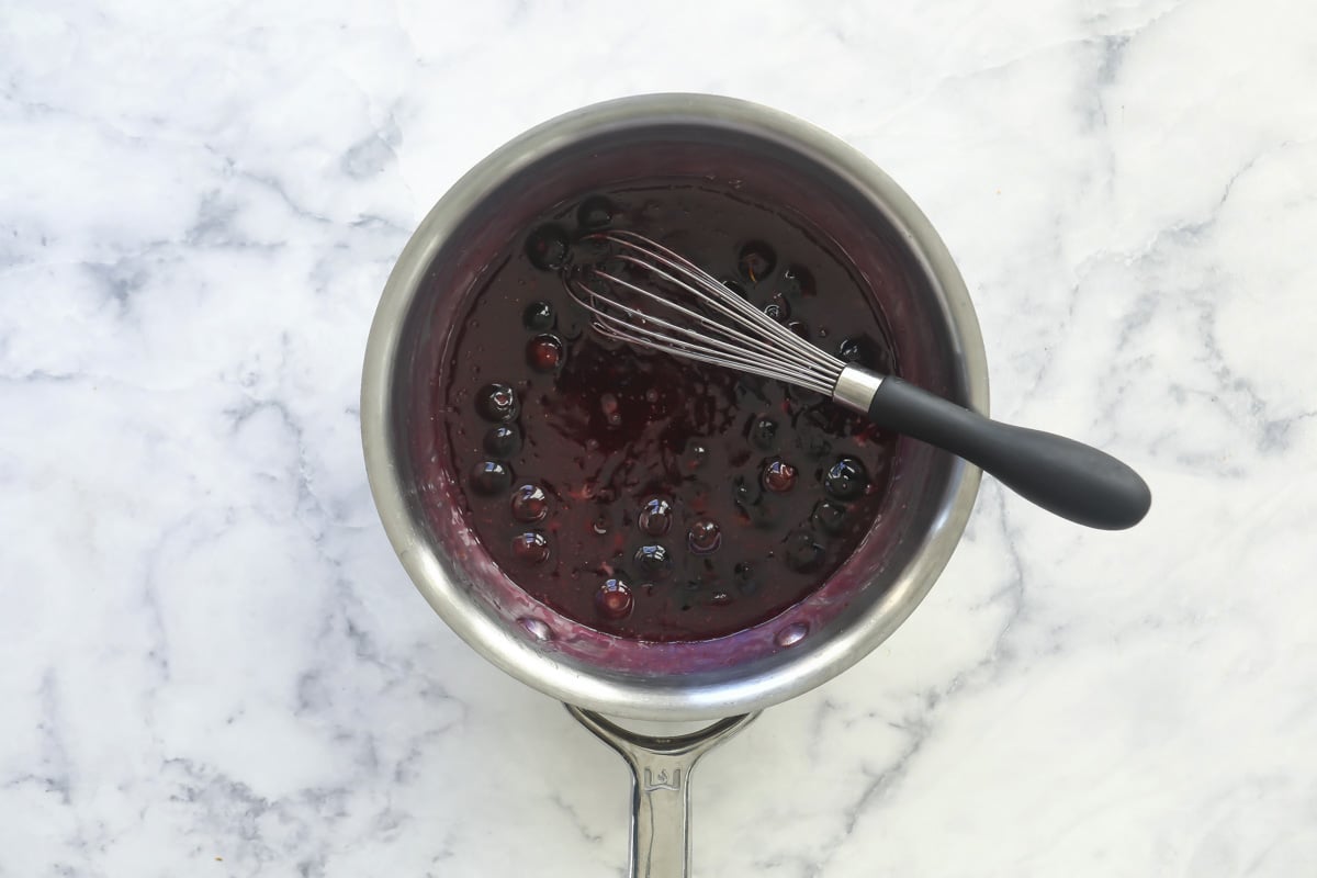 A saucepan of blueberry topping.