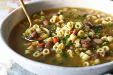 A bowl of pasta and bean soup.