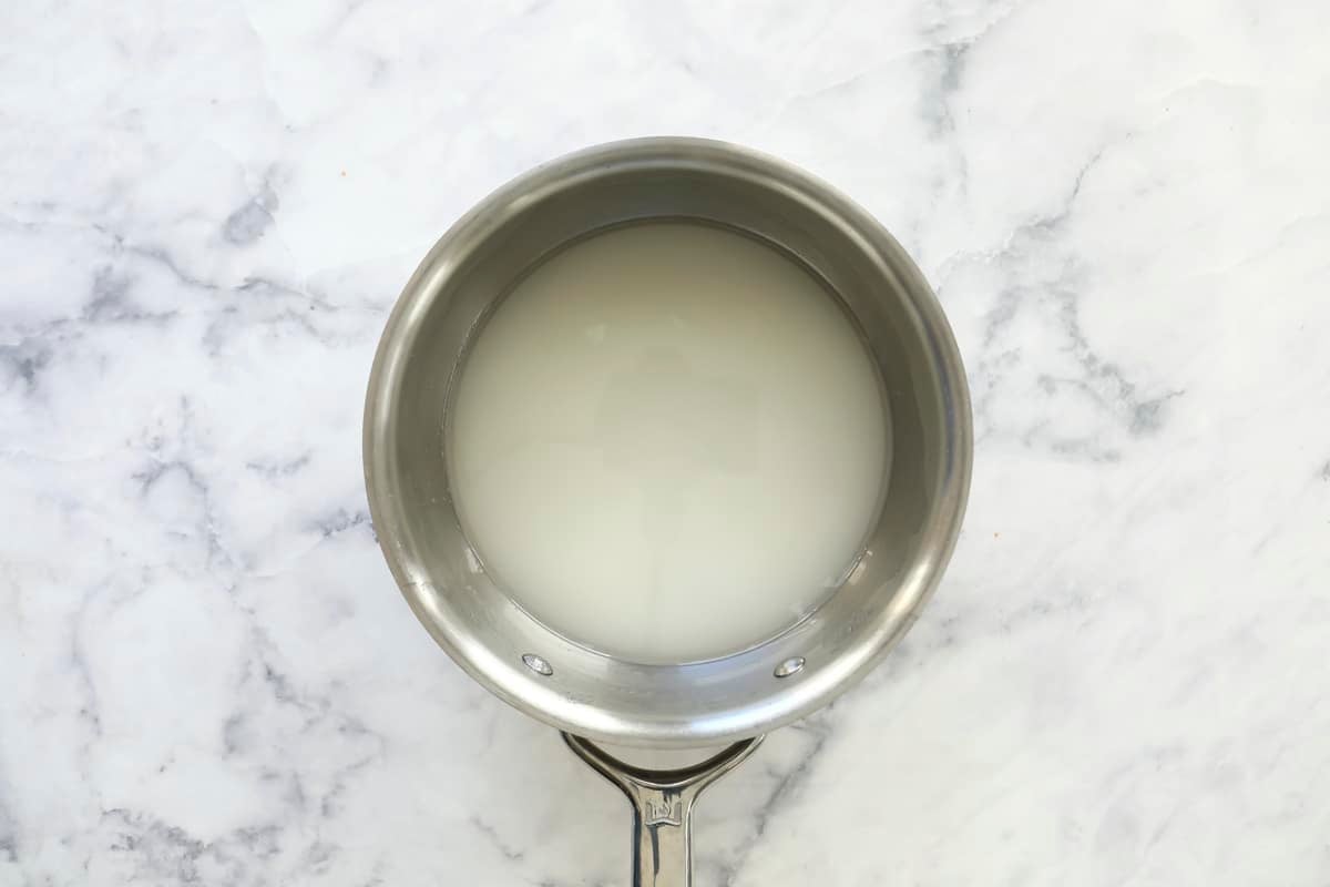 Sugar and water in a saucepan.