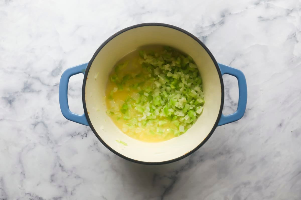 Vegetables softening in a pot.